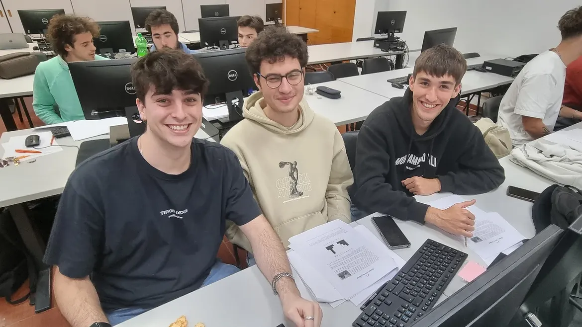 The three of us at our machine in the lab during the contest.